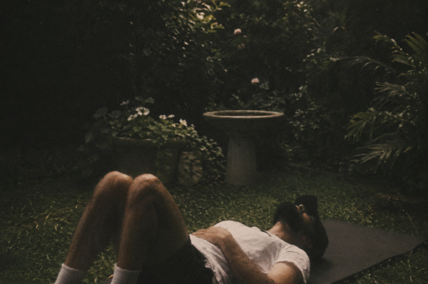Dmitri Ruwan laying on the grass
