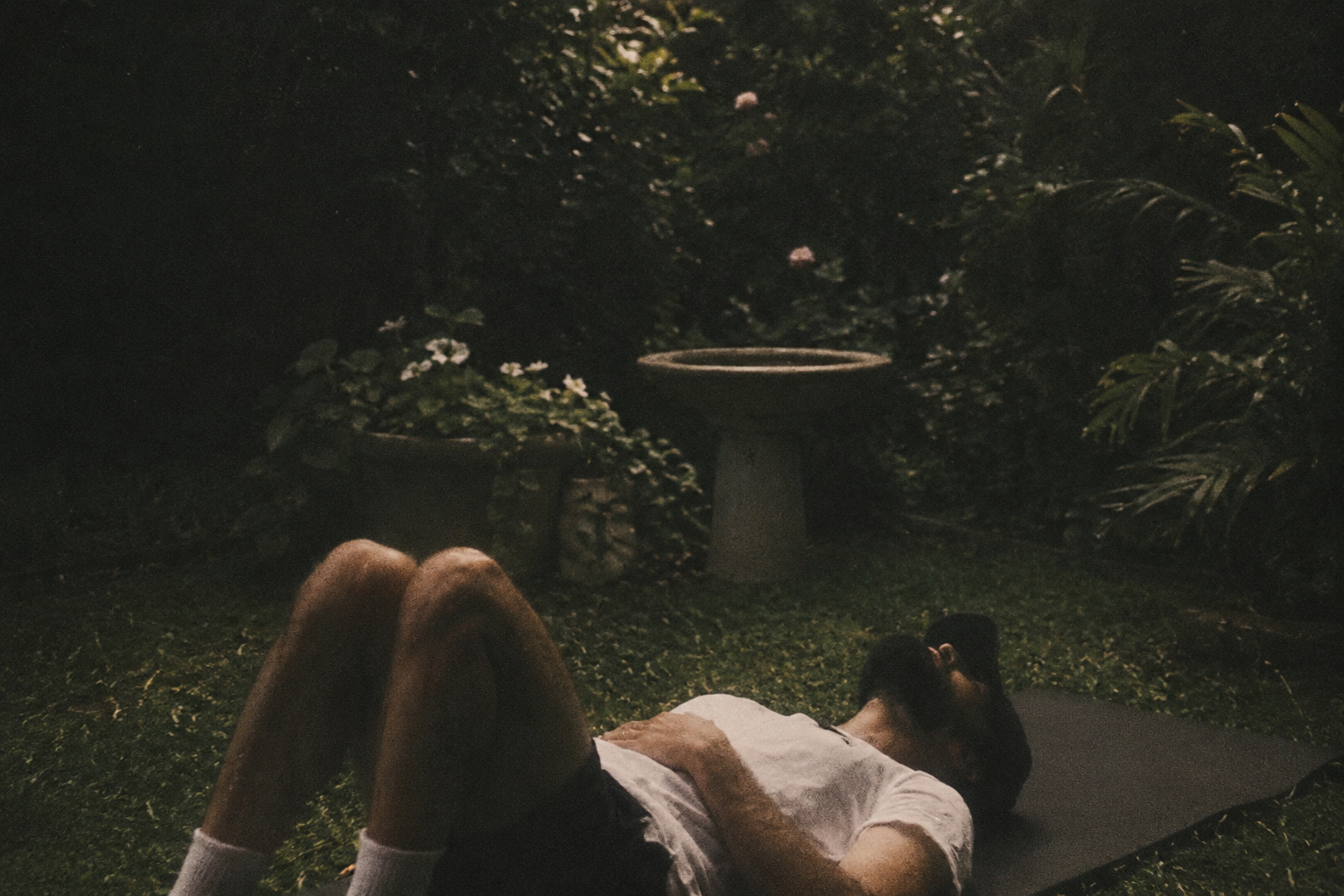 Dmitri Ruwan laying on the grass